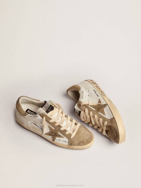 Golden Goose hombres zapatillas super-star de piel blanca con inserciones de ante gris tórtola y letras negras por toda la superficie 6846511