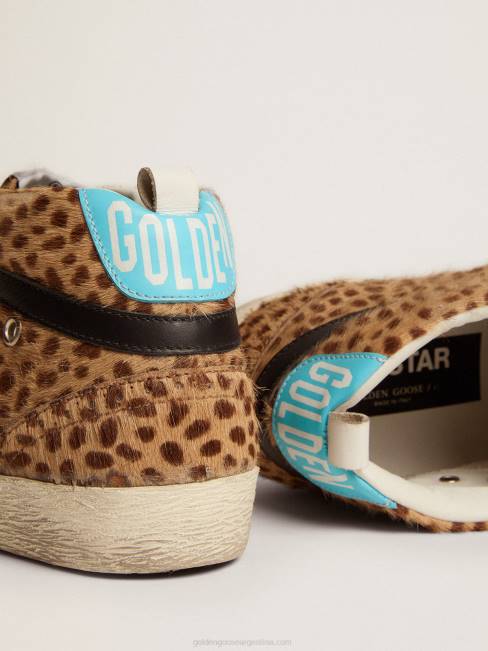 Golden Goose mujer zapatillas deportivas mid star de piel de potro animal print con estrella de purpurina plateada 6846110